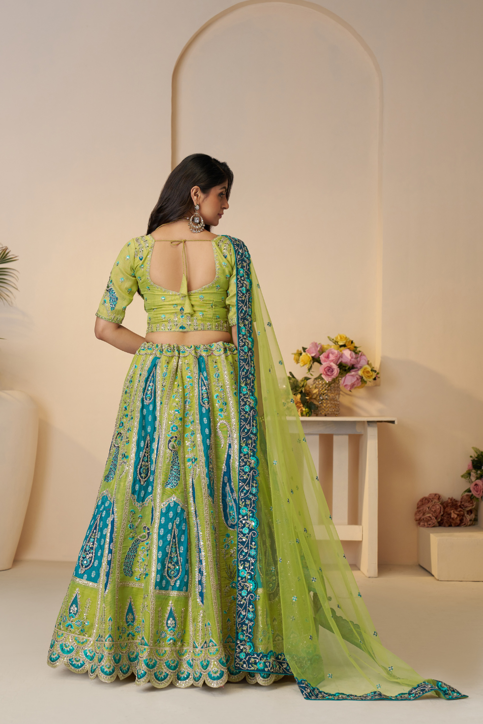 Royal Grandeur bridal  Green Soft Net Lehenga with Paisley and Peacock Motifs & Heavy Embroidery