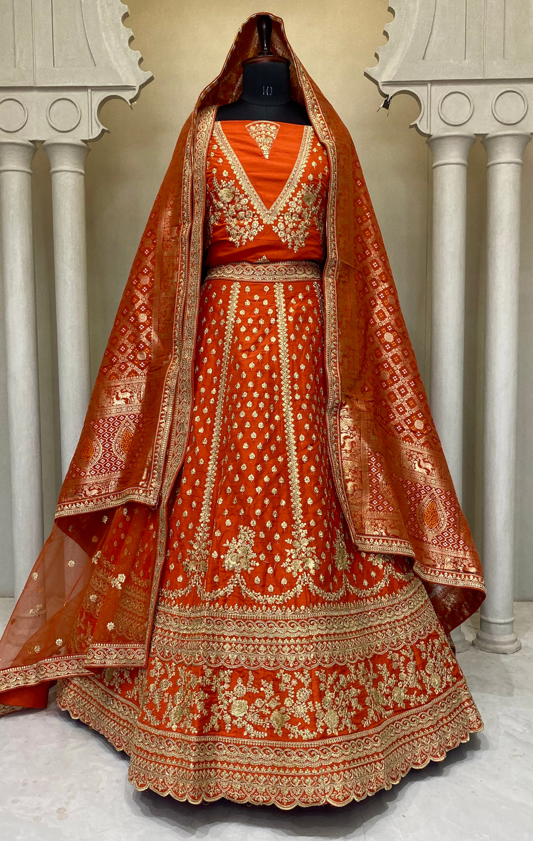 Traditional Indian Rani bridal lehenga crafted for global bride.